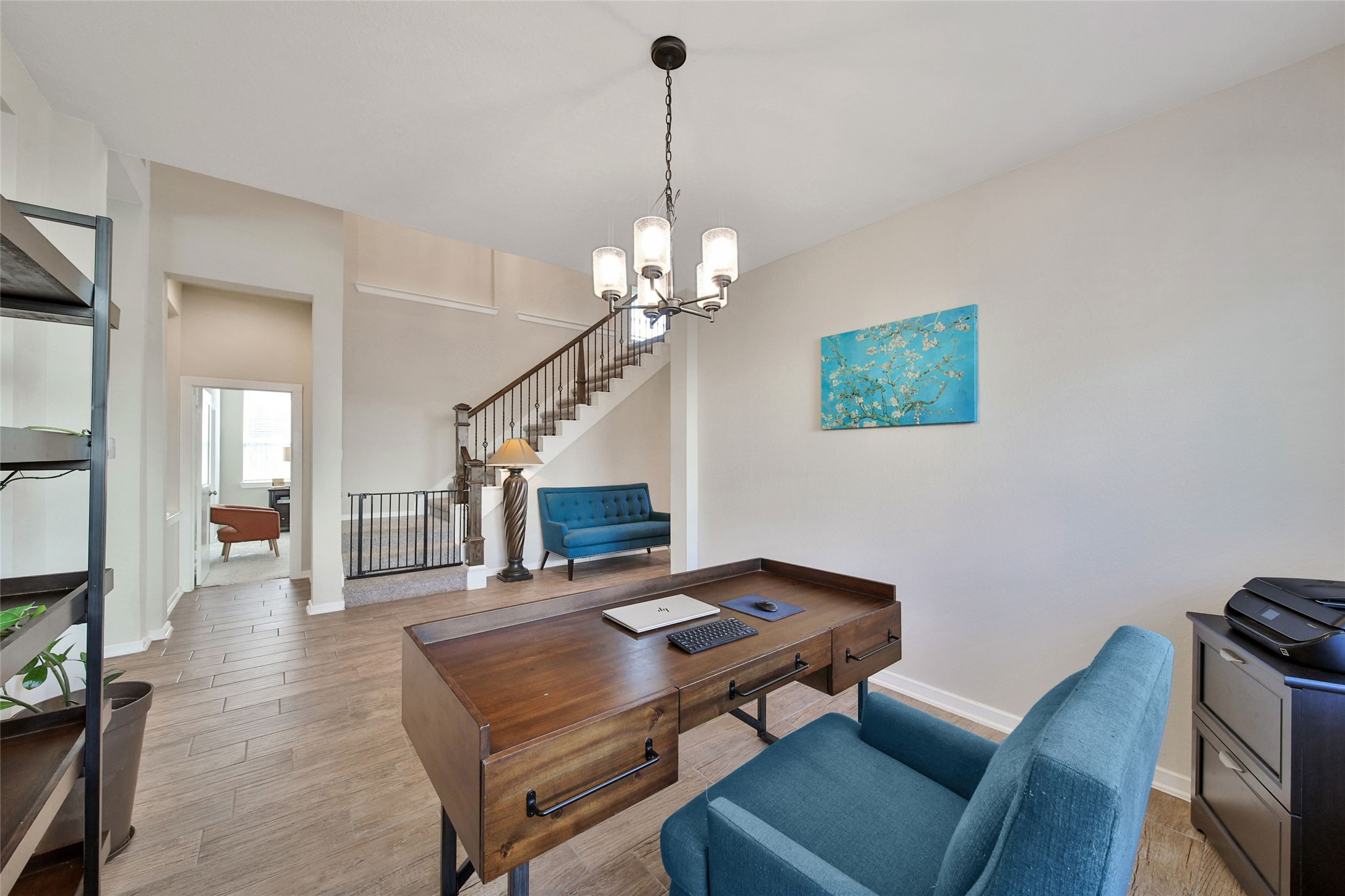 128 Yellow Perch Way Willis, TX 77318 - Photo 13 of 32 a living room with furniture and a chandelier