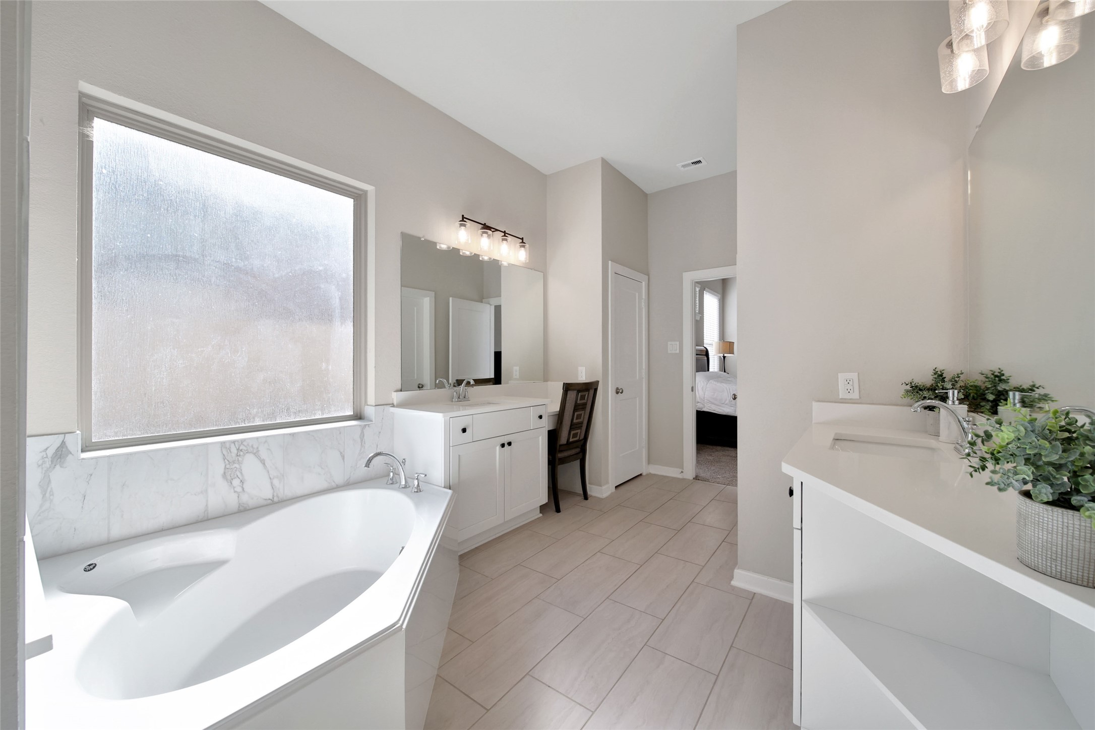128 Yellow Perch Way Willis, TX 77318 - Photo 17 of 32 a spacious bathroom with a tub sink and mirror