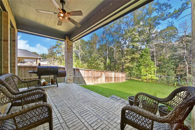 a view of a patio with a yard