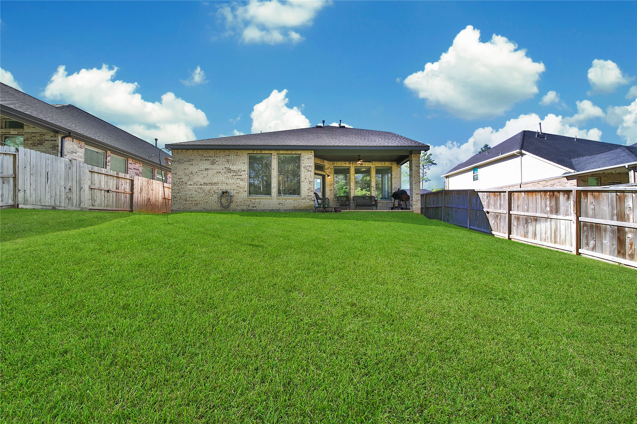 128 Yellow Perch Way Willis, TX 77318 - Photo 27 of 32 a view of a house with a yard