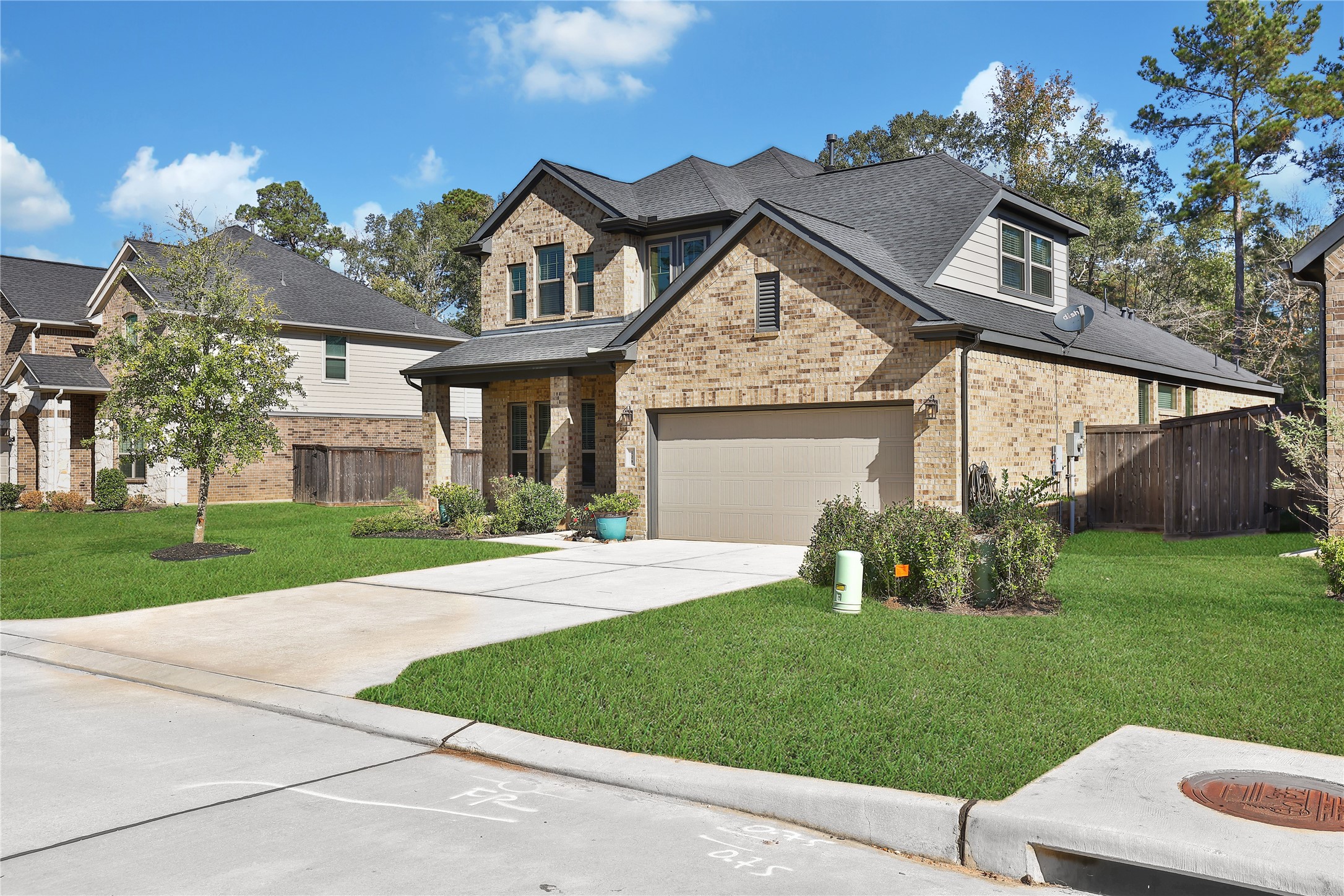 128 Yellow Perch Way Willis, TX 77318 - Photo 28 of 32 front view of a house with a yard
