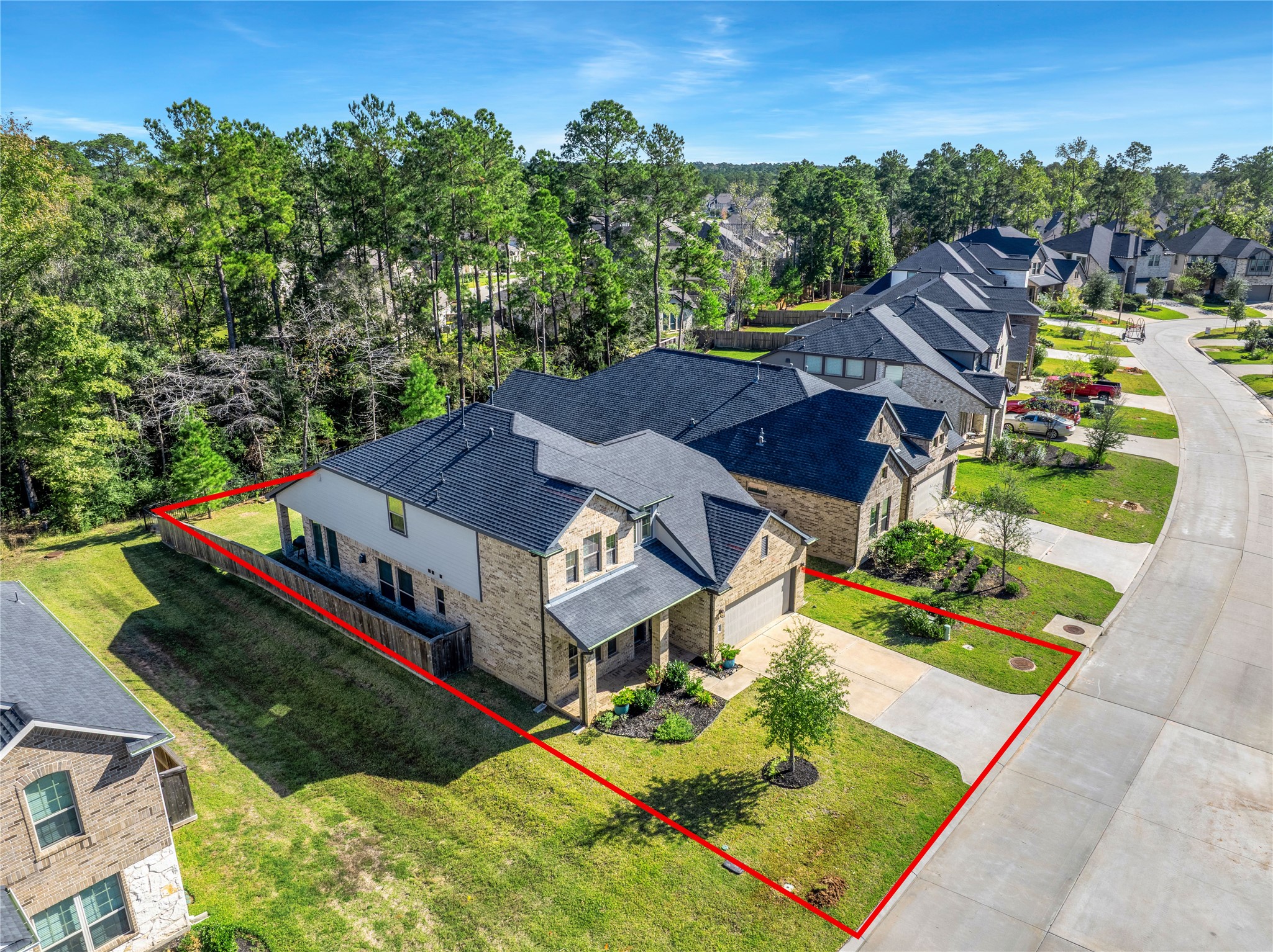 128 Yellow Perch Way Willis, TX 77318 - Photo 29 of 32 an aerial view of a house with a garden