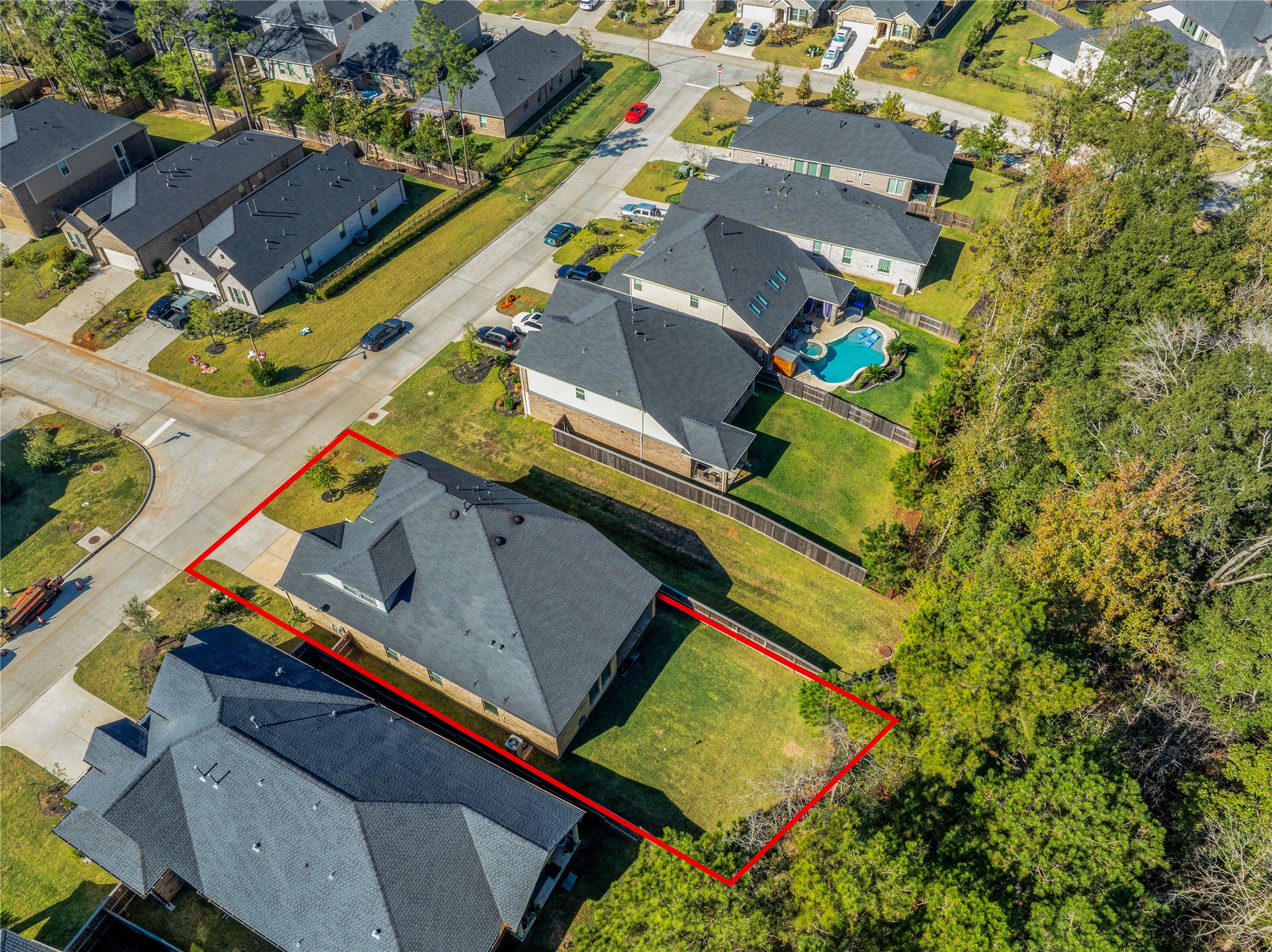 128 Yellow Perch Way Willis, TX 77318 - Photo 30 of 32 an aerial view of a house with a yard