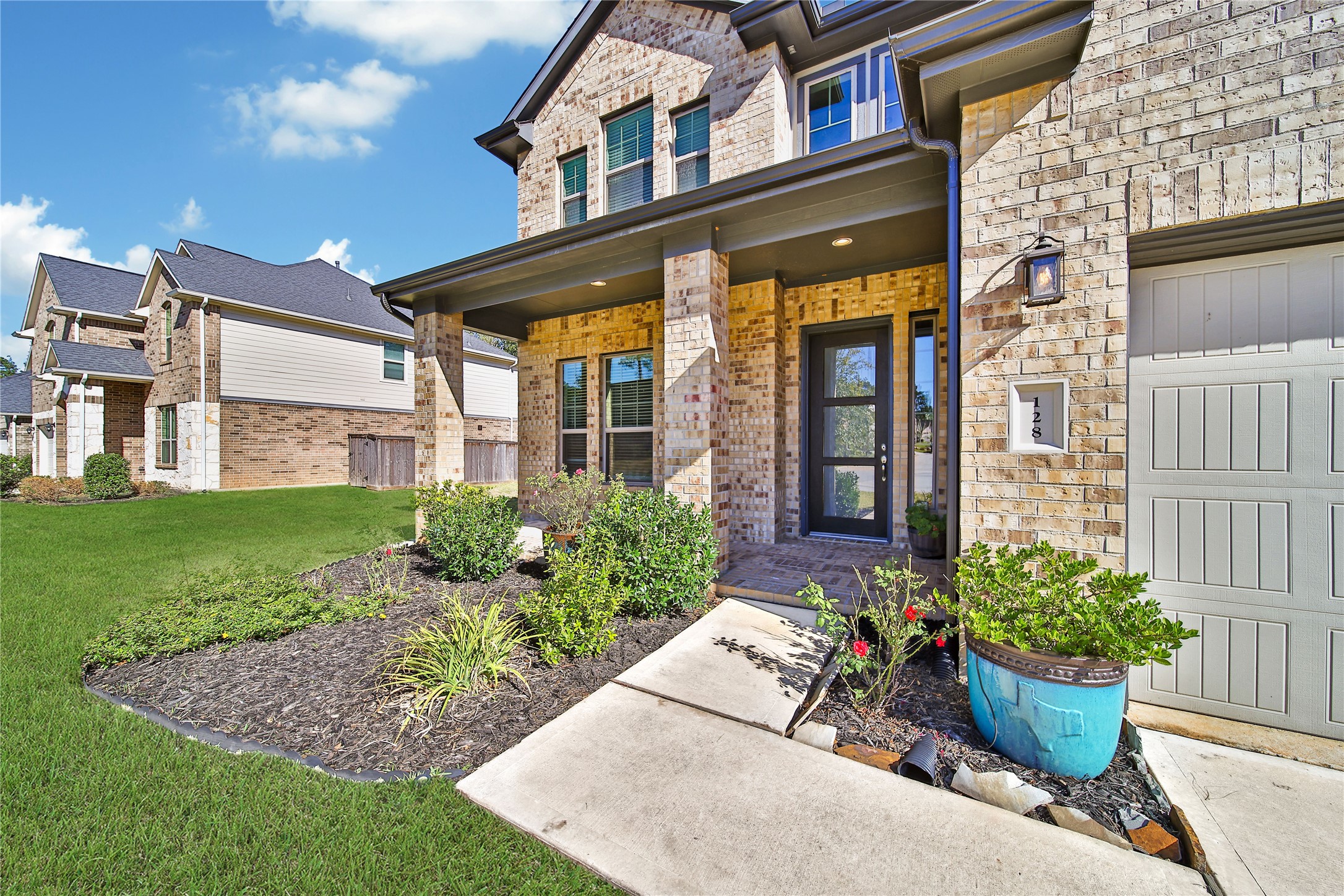 128 Yellow Perch Way Willis, TX 77318 - Photo 3 of 32 a view of a building with potted plants
