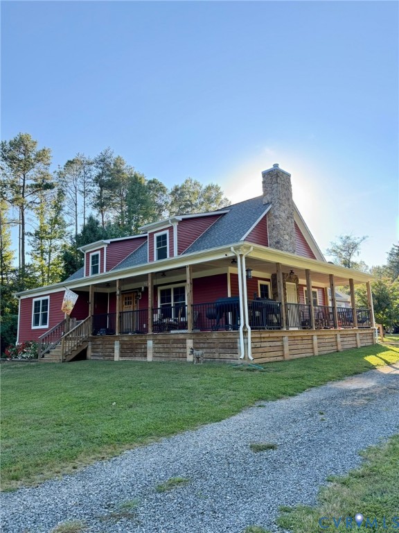 16233 Pleasant Mill Road Montpelier, VA 23192 - Photo 2 of 7 Red siding exterior with white trim, a broad wrap-