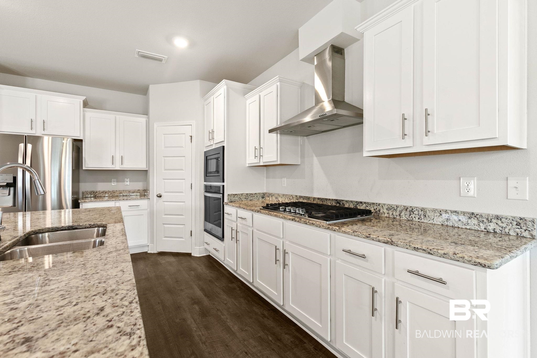 9448 Amethyst Drive Daphne, AL 36526 - Photo 16 of 61 Kitchen featuring white cabinetry and stainless steel appliances