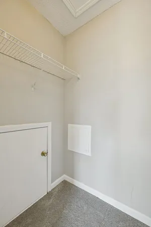 a view of a room with racks on the wall
