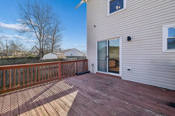 a view of backyard with a deck