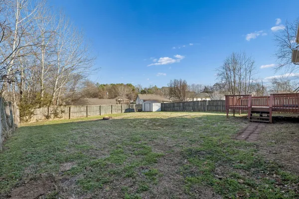 a view of outdoor space with garden and trees