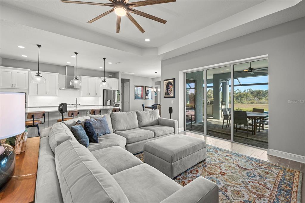 14375 Skipping Stone Loop Parrish, FL 34219 - Photo 11 of 87 a living room with furniture and a table