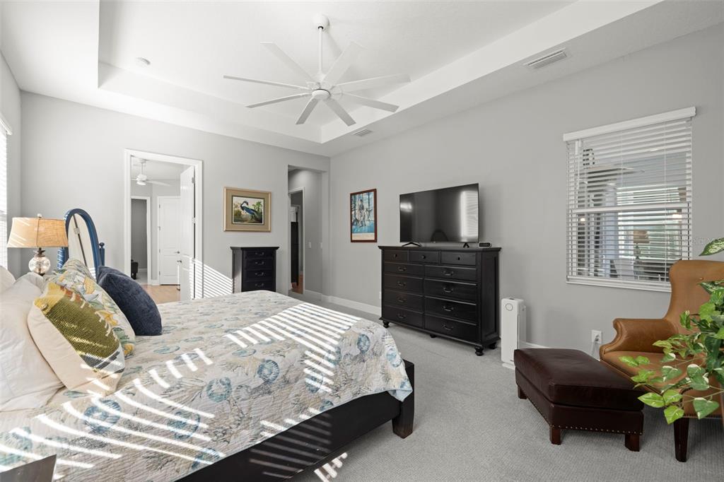 14375 Skipping Stone Loop Parrish, FL 34219 - Photo 27 of 87 a bedroom with a bed and a television