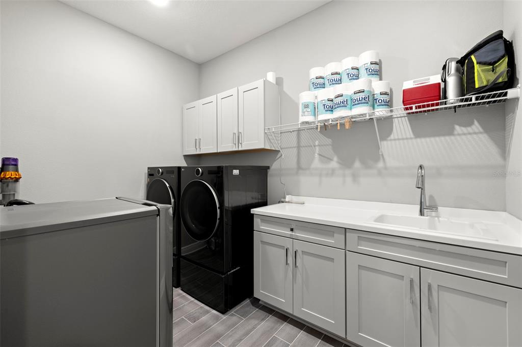 14375 Skipping Stone Loop Parrish, FL 34219 - Photo 33 of 87 a utility room with sink dryer and washer