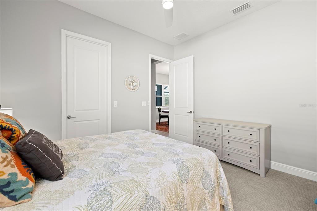 14375 Skipping Stone Loop Parrish, FL 34219 - Photo 39 of 87 a bedroom with a bed and a closet