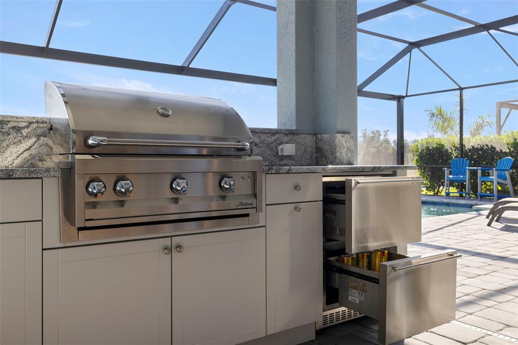 14375 Skipping Stone Loop Parrish, FL 34219 - Photo 49 of 87 a kitchen with stainless steel appliances granite countertop a stove a sink and a refrigerator