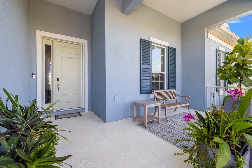 14375 Skipping Stone Loop Parrish, FL 34219 - Photo 5 of 87 a living room with furniture and a potted plant