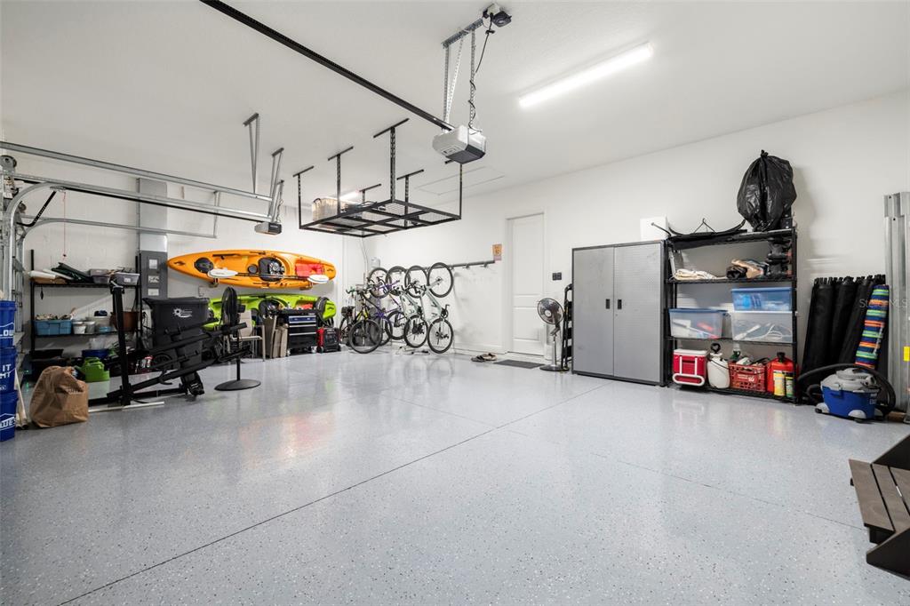 14375 Skipping Stone Loop Parrish, FL 34219 - Photo 61 of 87 a view of a garage with storage and utility