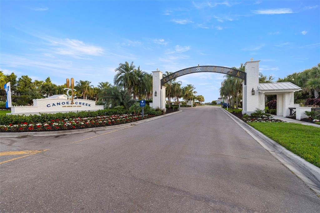 14375 Skipping Stone Loop Parrish, FL 34219 - Photo 67 of 87 a view of a street with a building in the background