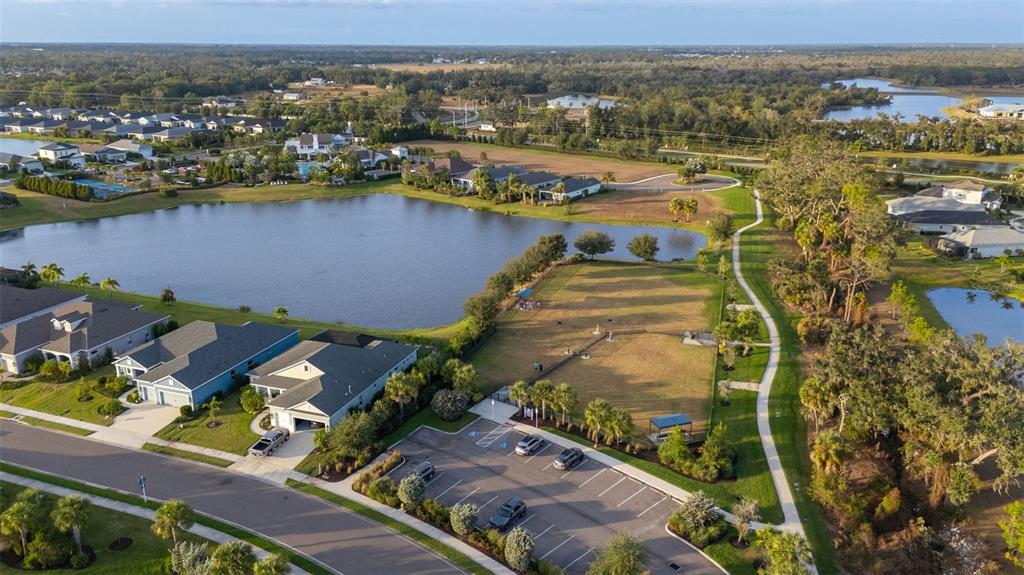 14375 Skipping Stone Loop Parrish, FL 34219 - Photo 83 of 87 an aerial view of a residential houses with outdoor space