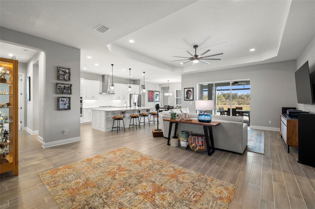 14375 Skipping Stone Loop Parrish, FL 34219 - Photo 10 of 87 a living room with furniture and a flat screen tv