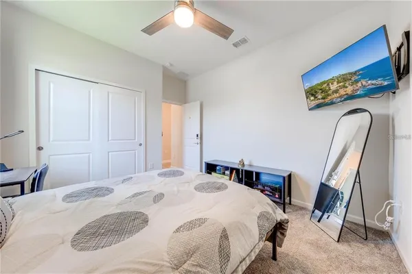 a kitchen with stainless steel appliances kitchen island granite countertop a stove a sink a dining table and chairs