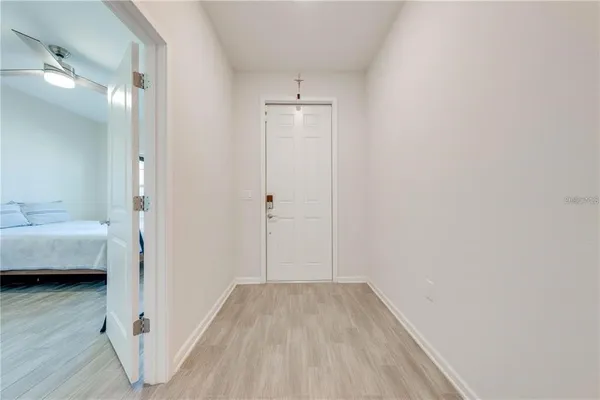 a spacious bedroom with a bed and a window