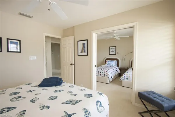 a bedroom with a bed and a chair