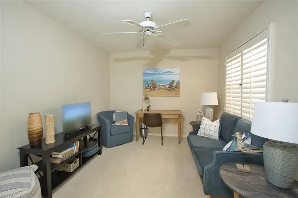 a living room with furniture and a window