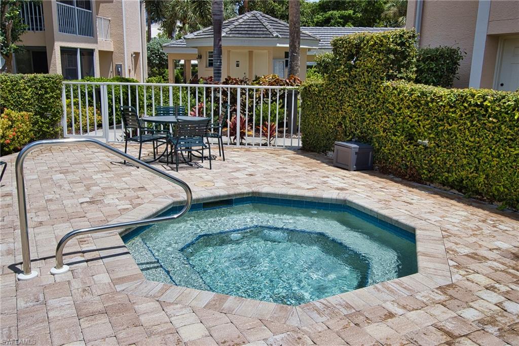 5637 Turtle Bay Drive, Unit II22 Naples, FL 34108 - Photo 20 of 20 a view of a house with backyard porch and sitting area