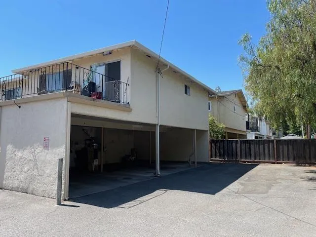 a front view of a house with parking