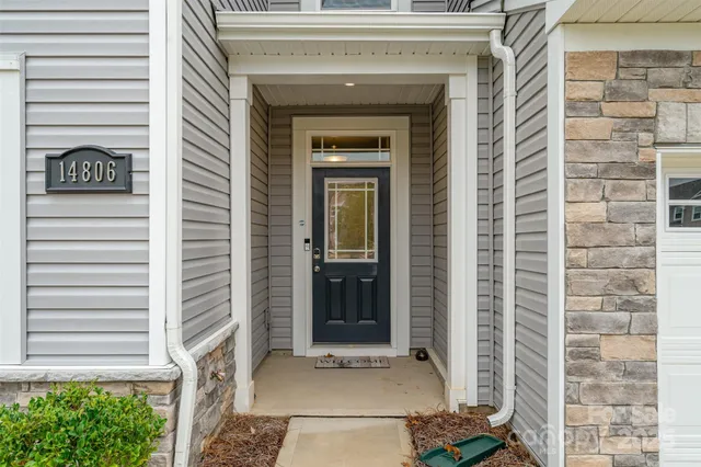a view of a closet area with an empty room