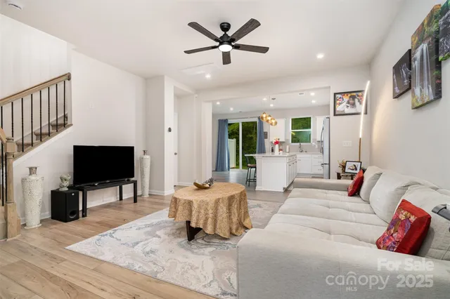 a kitchen with a sink a counter top space and stainless steel appliances