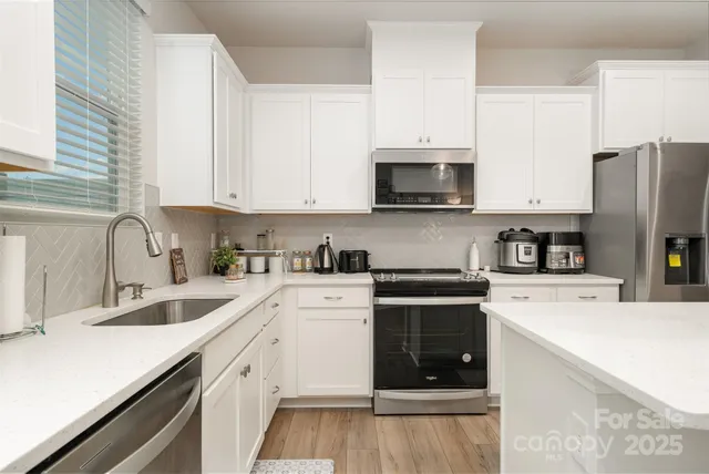 a bathroom with a sink a vanity and a mirror