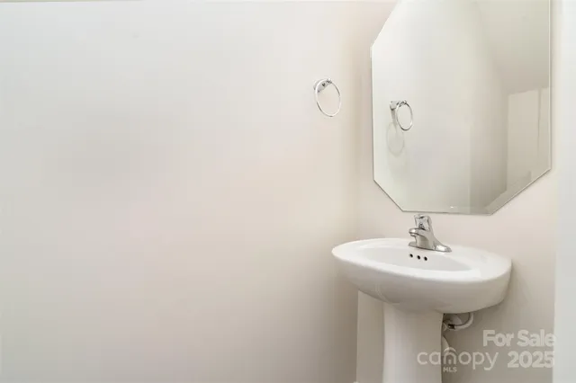 a large white bed in a white room