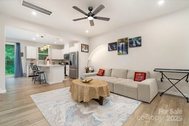 a living room with furniture and a table