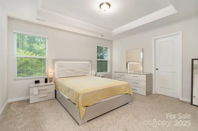 a bathroom with a toilet a sink a mirror and a shower