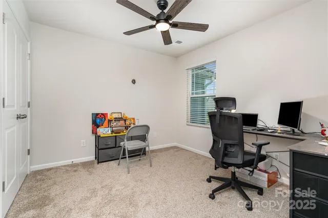 a bathroom with a sink a toilet a mirror and shower
