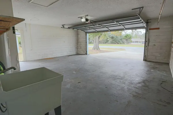 a view of room with window and hallway