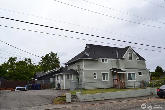a front view of a house with garage