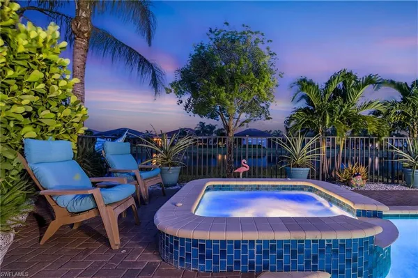 a view of a swimming pool with a patio