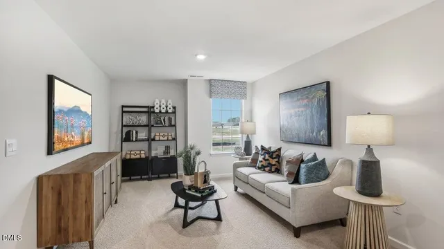 a living room with furniture and a lamp