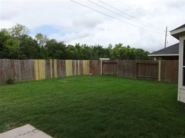 a house that has a big yard in front of it