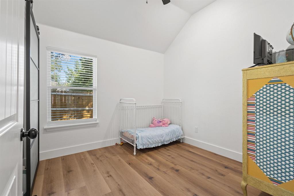 511 Maple Street Howe, TX 75459 - Photo 25 of 38 a bedroom with a bed and window