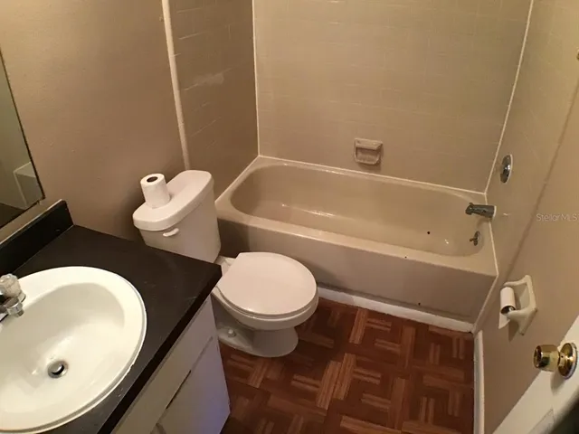 a bathroom with a sink and toilet