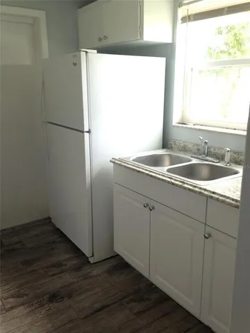 a kitchen with a sink and a window