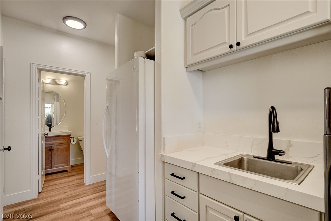 4362 Thistle Street Logandale, NV 89021 - Photo 64 of 99 Functional prep area with sink and convenient access to the adjacent bathroom and garage.