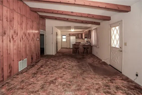 a view of a livingroom with furniture and chandelier