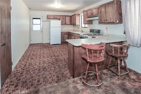 a table and chairs in a kitchen