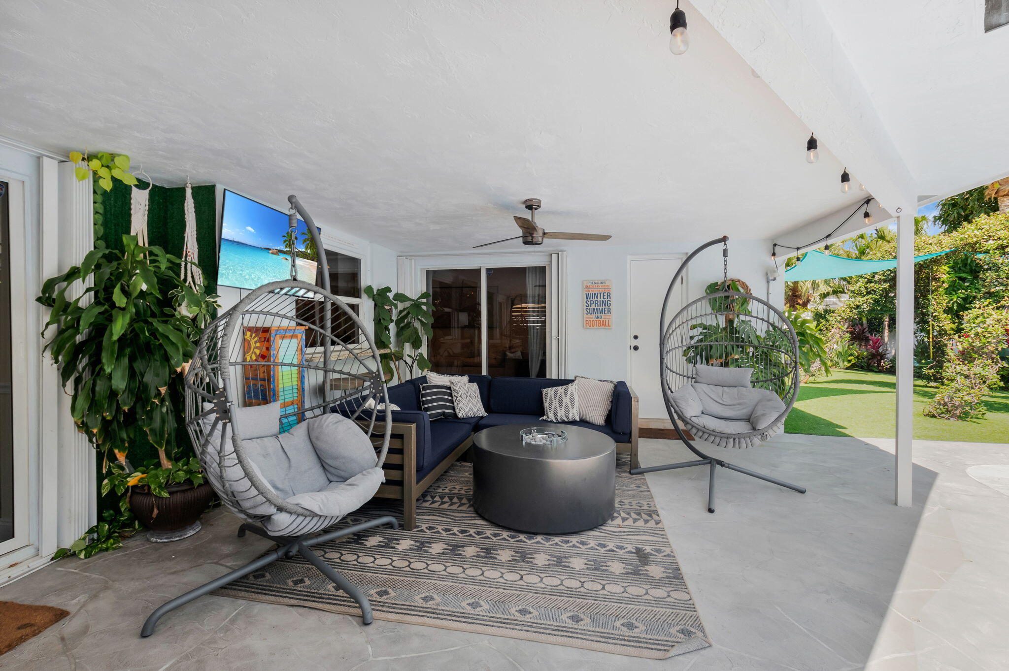 769 Berkley Street Boca Raton, FL 33487 - Photo 51 of 106 a living room with patio furniture and a potted plant