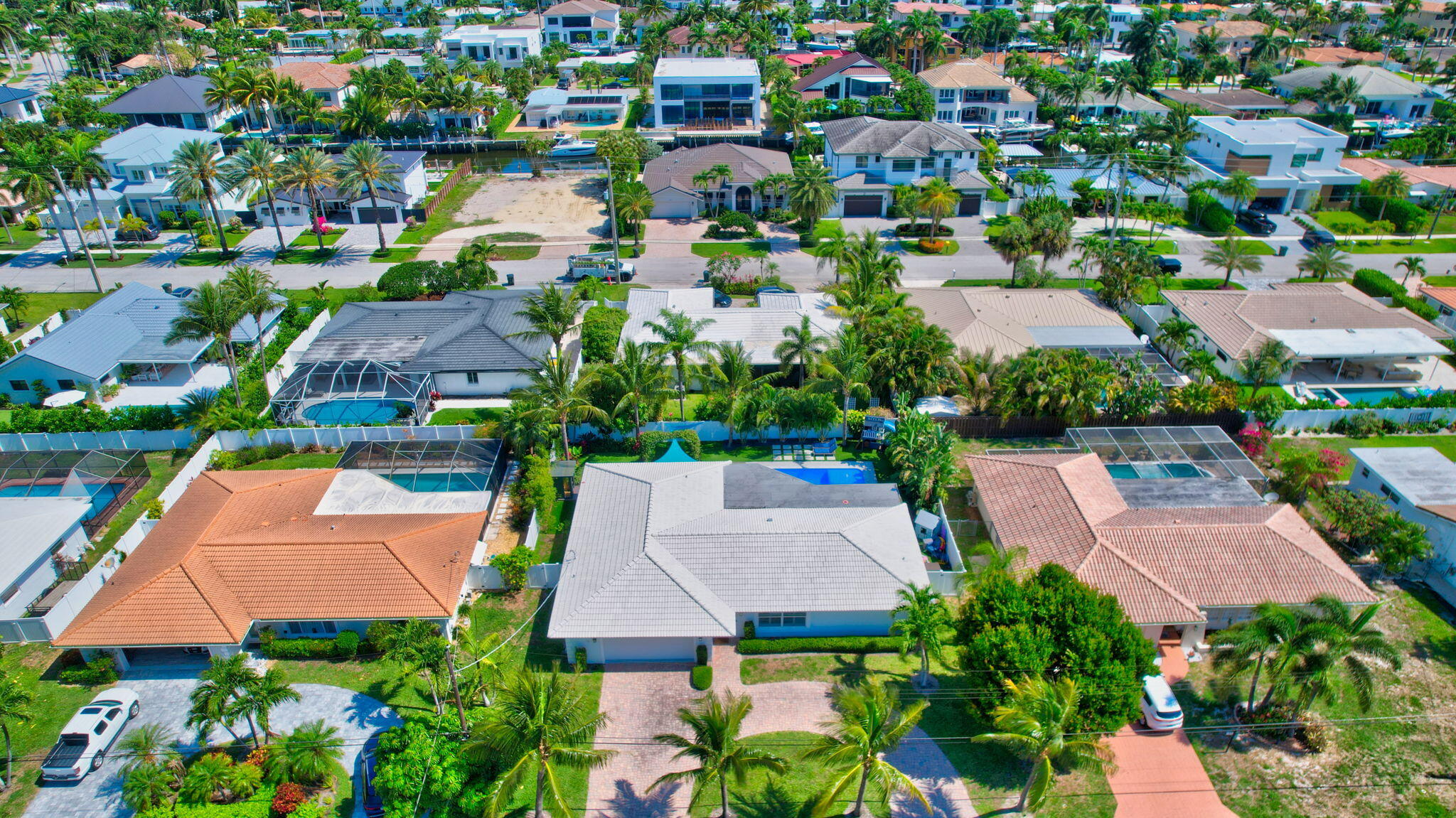 769 Berkley Street Boca Raton, FL 33487 - Photo 92 of 106 an aerial view of multiple houses with yard
