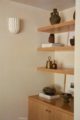 a living room with furniture and flower pot